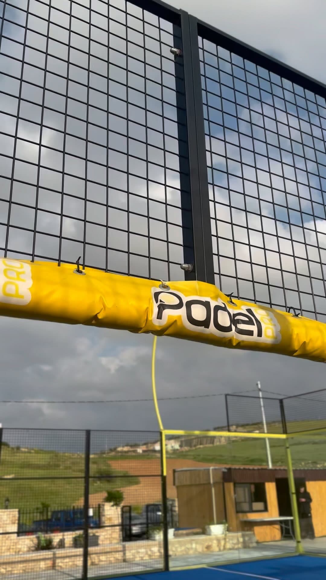 Courtside — Yellow posts, glass walls